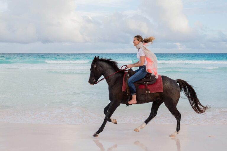 Sarah Wood Photography - woman riding horse on beach