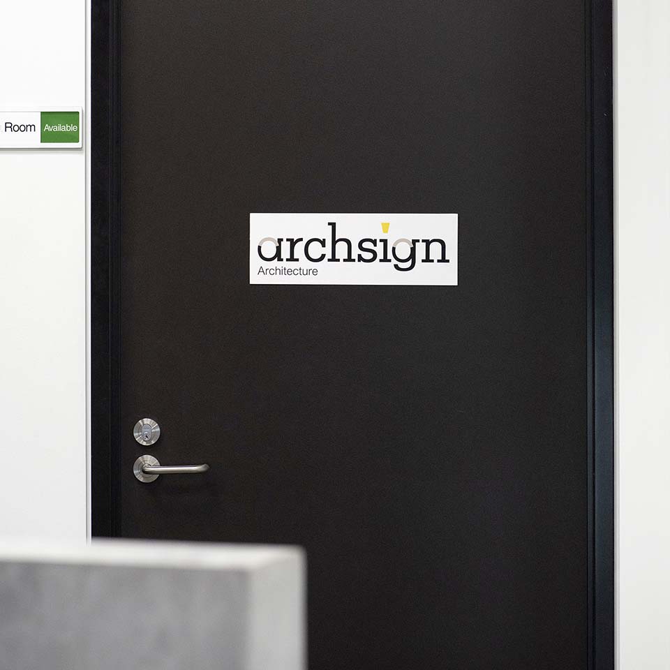 Branded metal rectangular sign on door