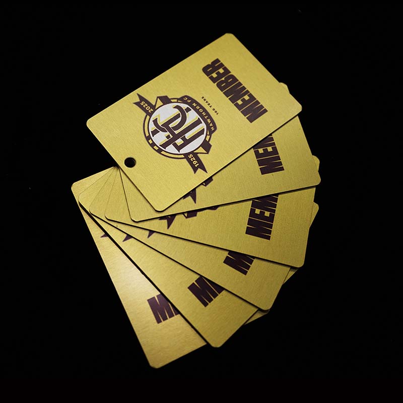 Hawthorn Football Club 100 years - metal membership cards fanned on table