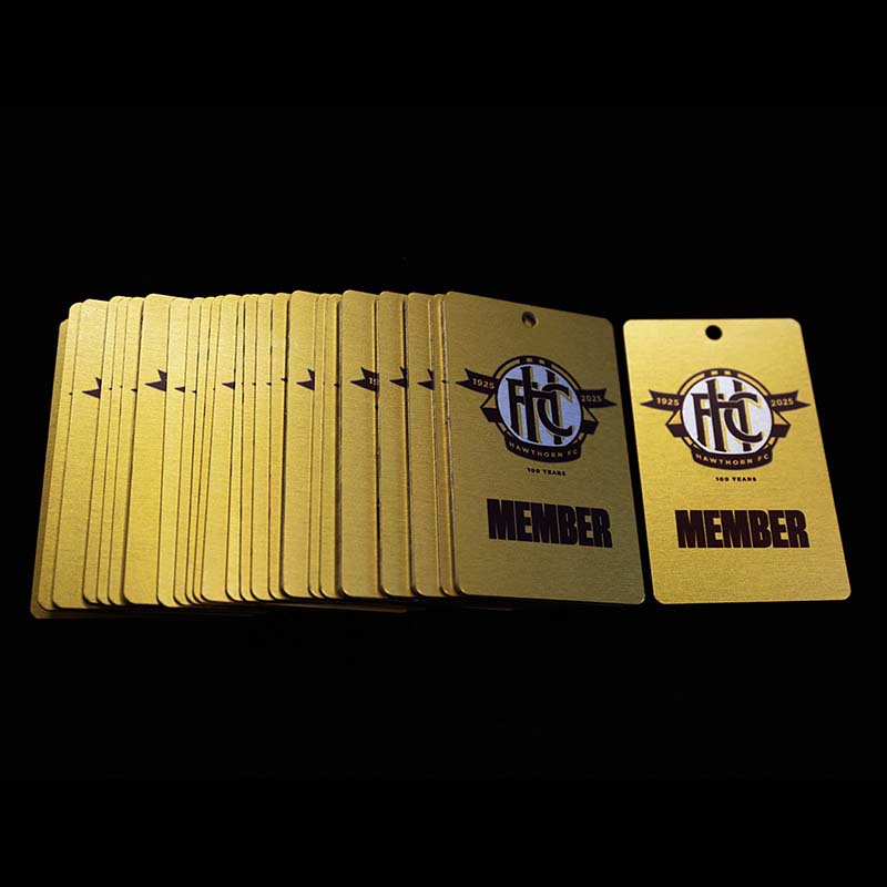 Hawthorn Football Club 100 years - metal membership cards spread out on table