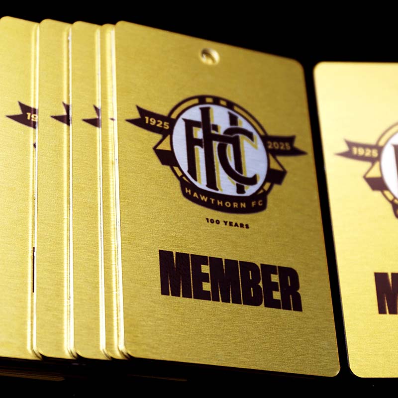 Hawthorn Football Club 100 years - metal membership cards close up of pile