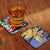 Custom print coasters with glass on table