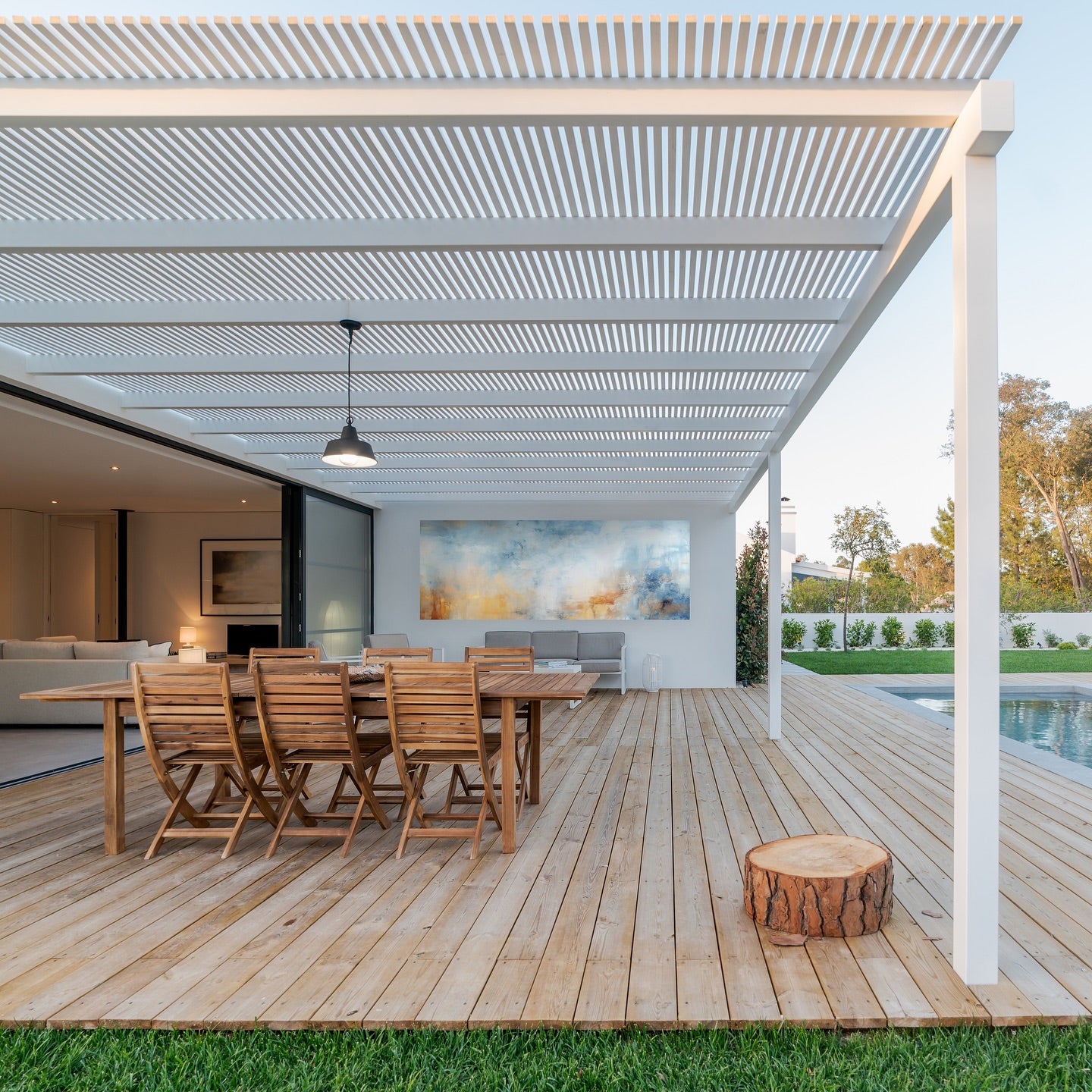 Modern outdoor setting with custom metal print on wall